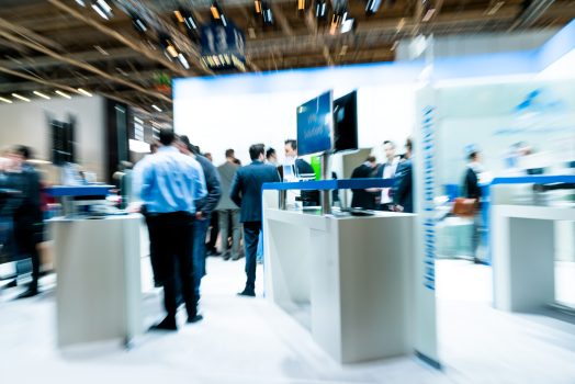 Blurred people at a trade fair